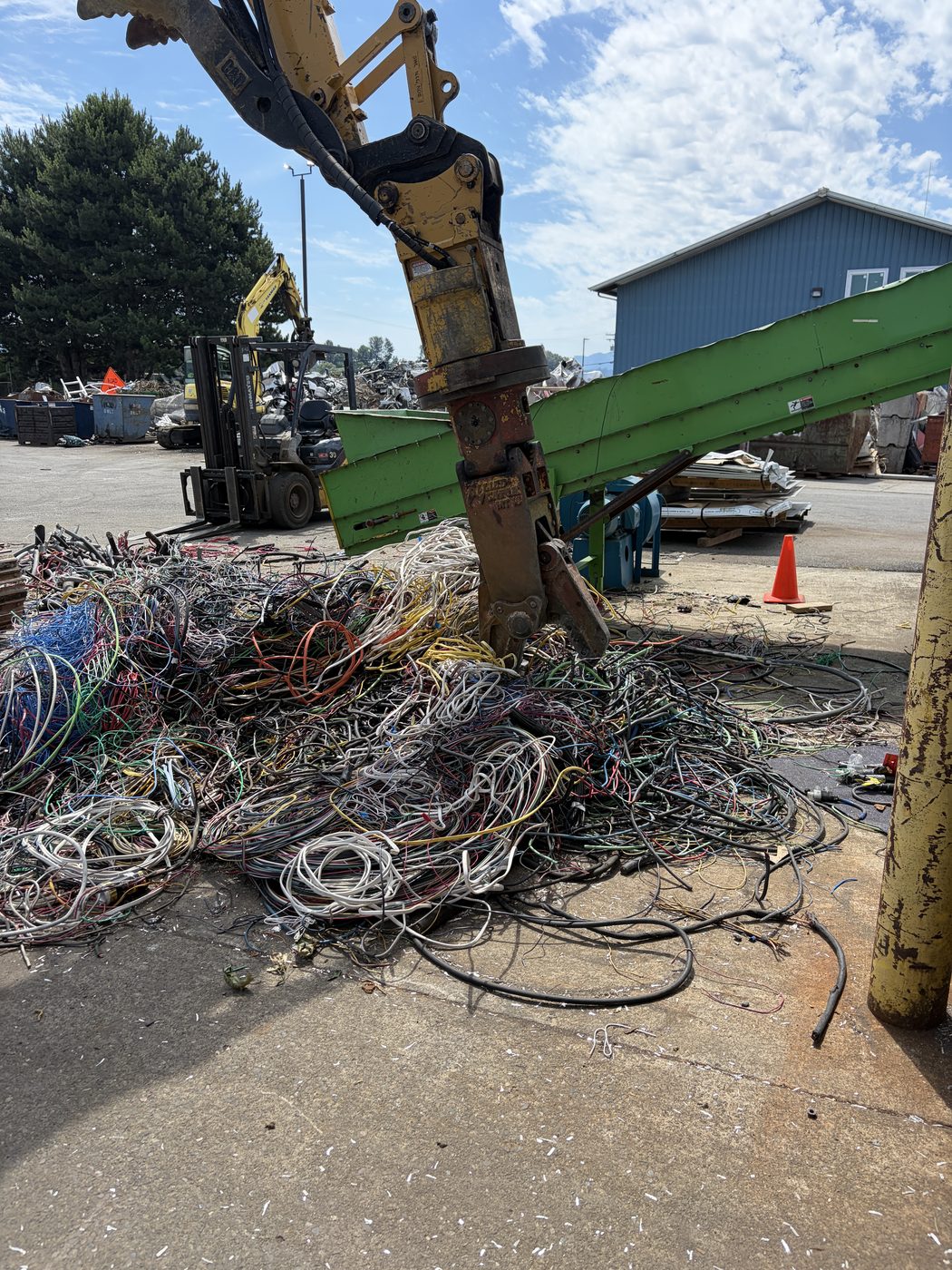 Material handler sorting non-ferrous scrap metal