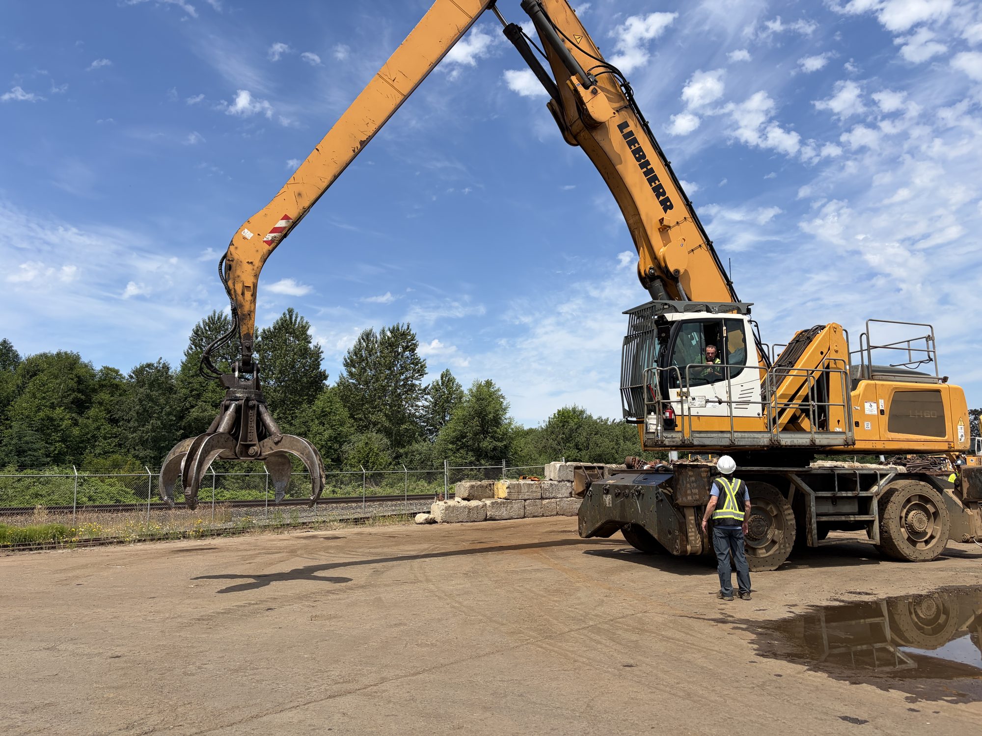 Material handler working the scrap yard at Skagit River Steel & Recycling in Burlington, WA