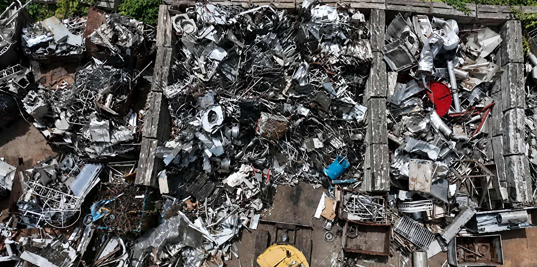 Material handler lifting non-ferrous job-site scrap